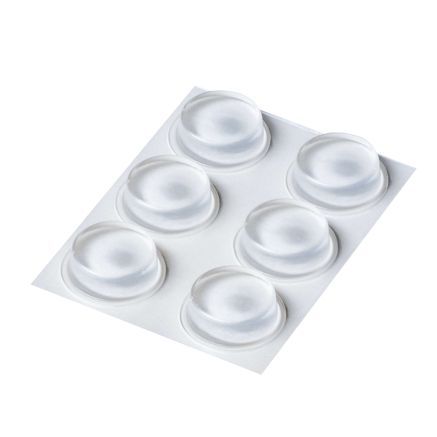 An adhesive backed sheet of six clear flat topped bumper feet.