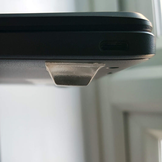 Square bumper used as feet on a laptop