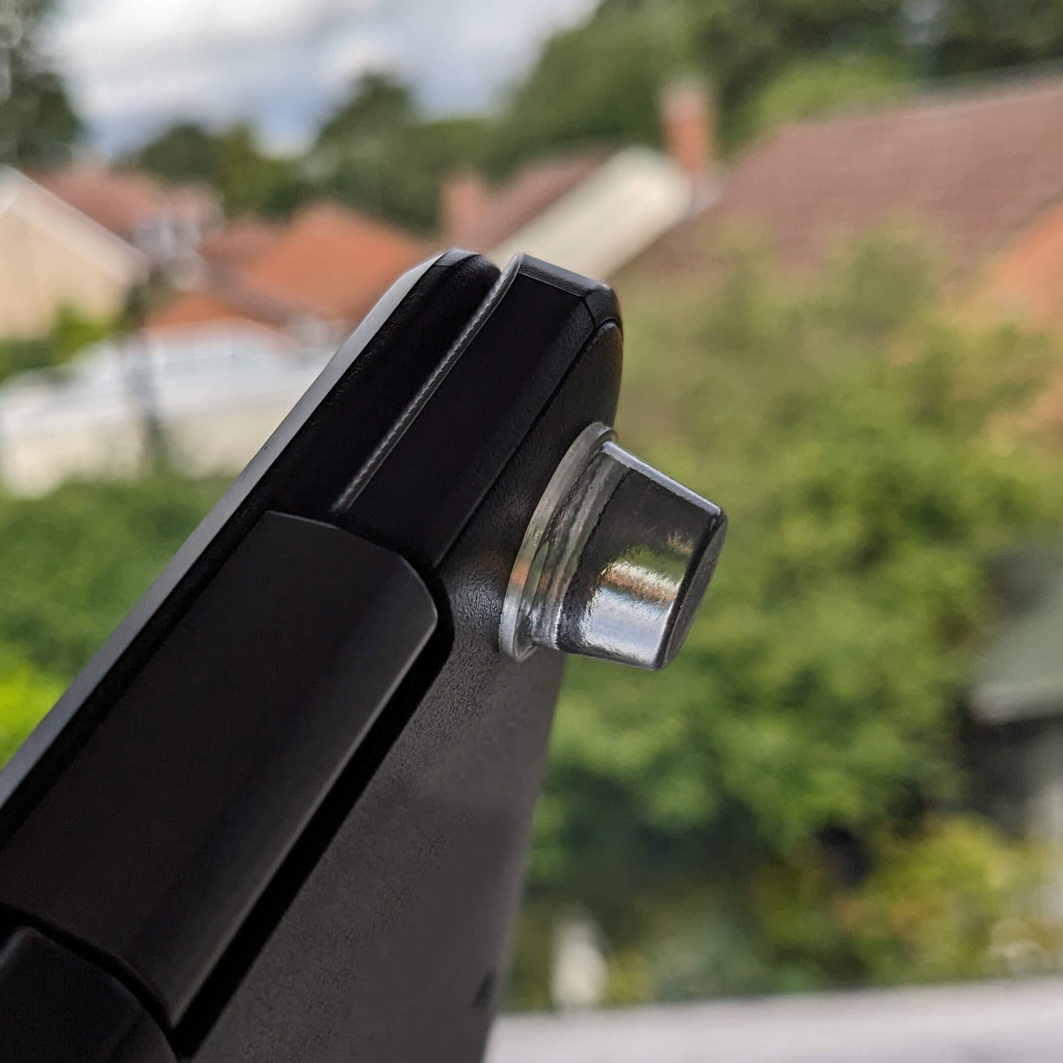 Clear bumper with a flat top being used on the underside of a laptop.