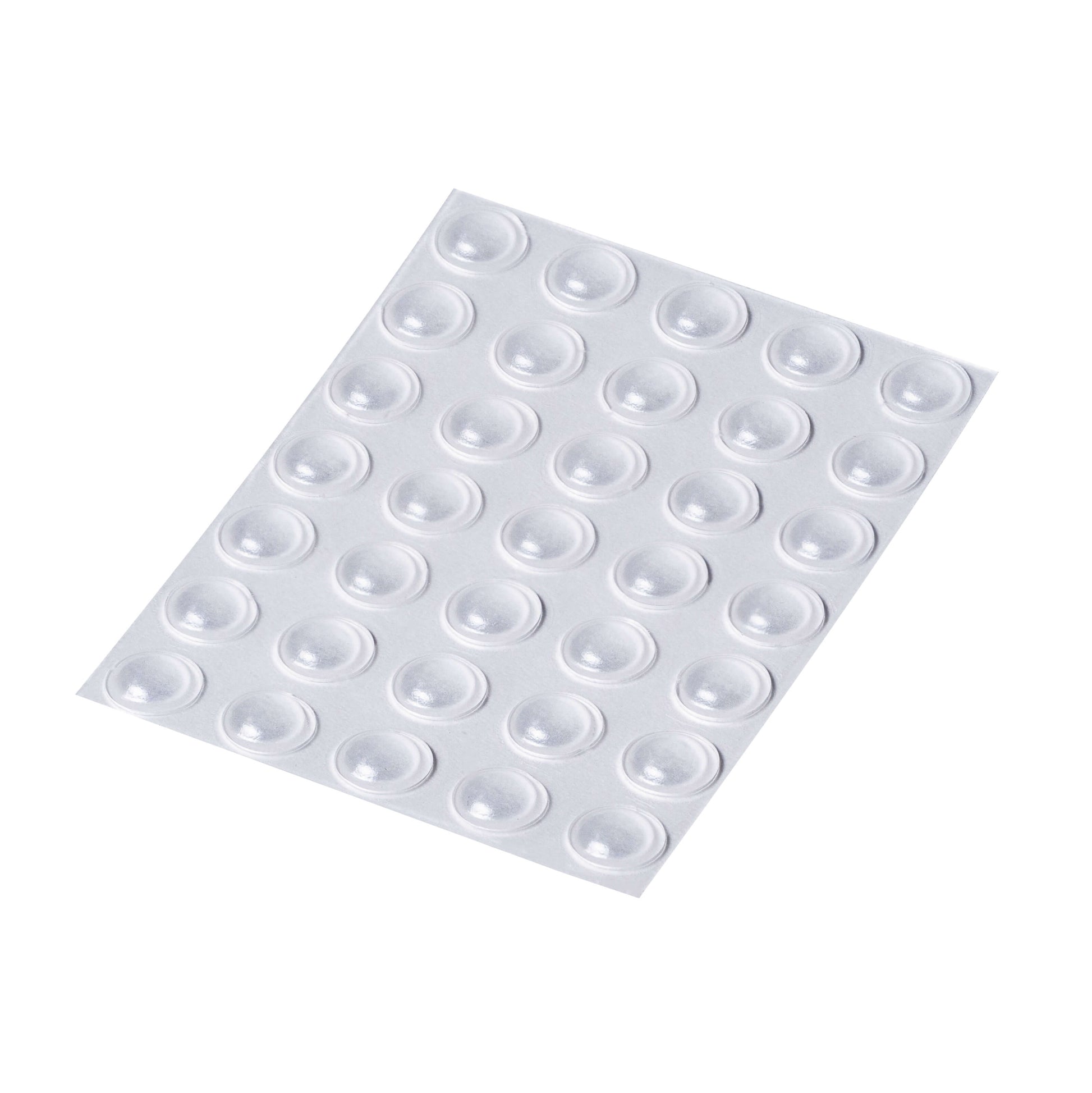 An adhesive backed sheet of 35 clear small domed bumper feet.