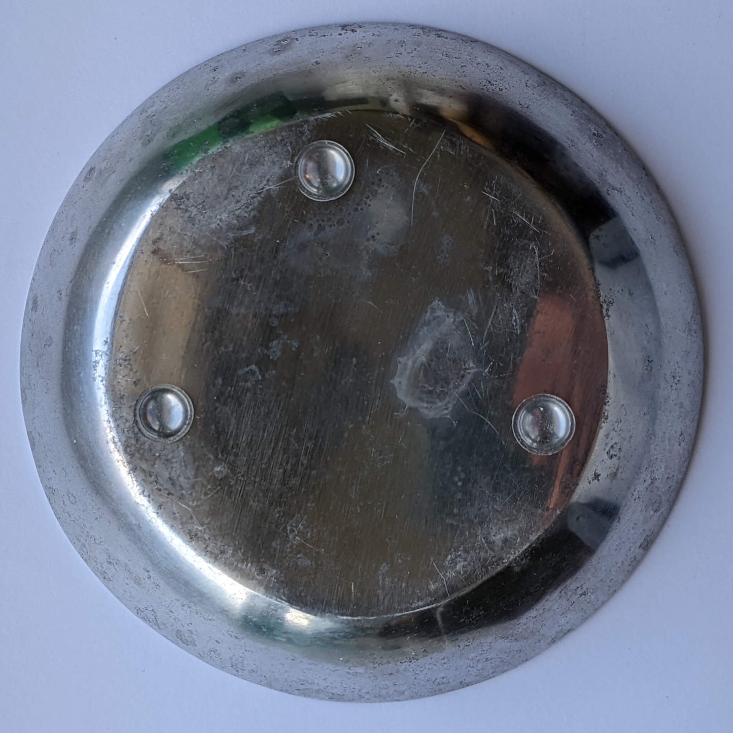 3 domed bumper feet used on the base of a metal bowl to prevent wobbling. 