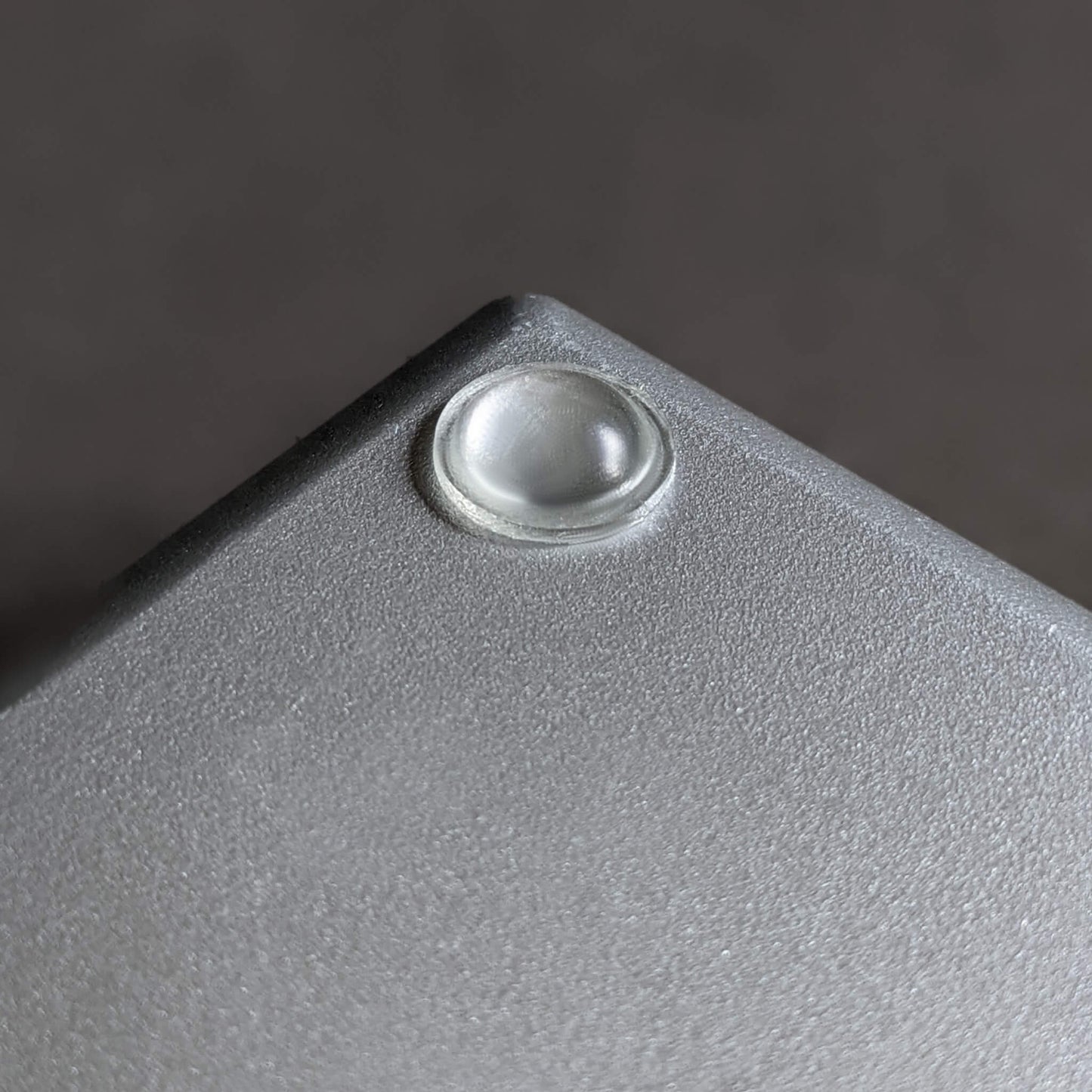 A single clear domed bumper foot used on the base of some electronic scales.