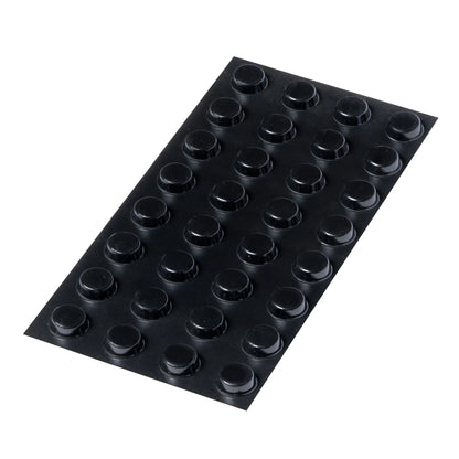 A sheet of 32 black flat topped bumper feet.