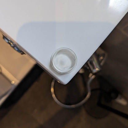 A clear flat topped bumper pad being used on a bathroom unit.