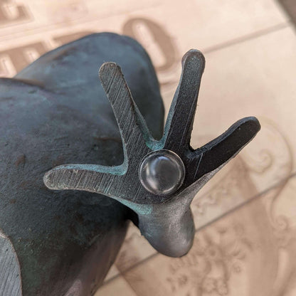 Clear domed bumper used on the base of a metal frog ornament.