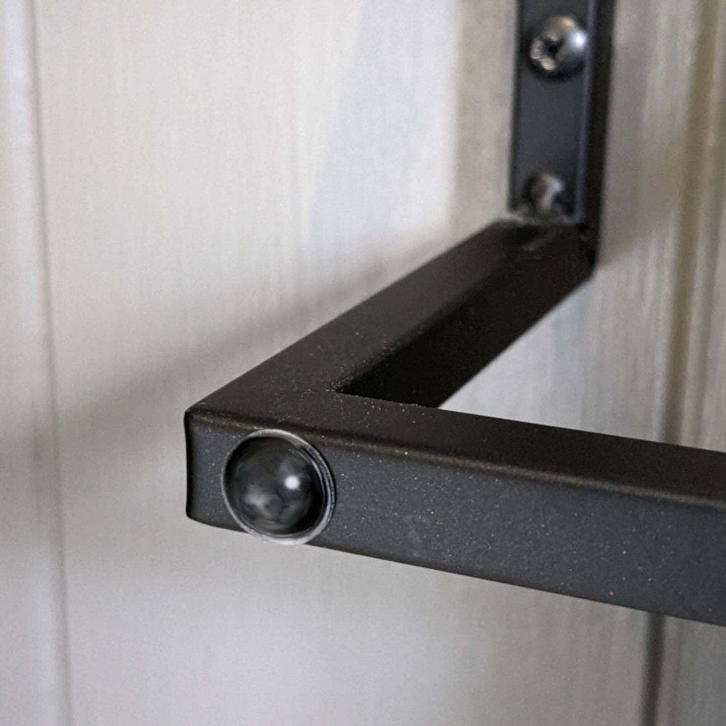 Domed bumper used on a towel rail to stop the door from being damaged when  in contact