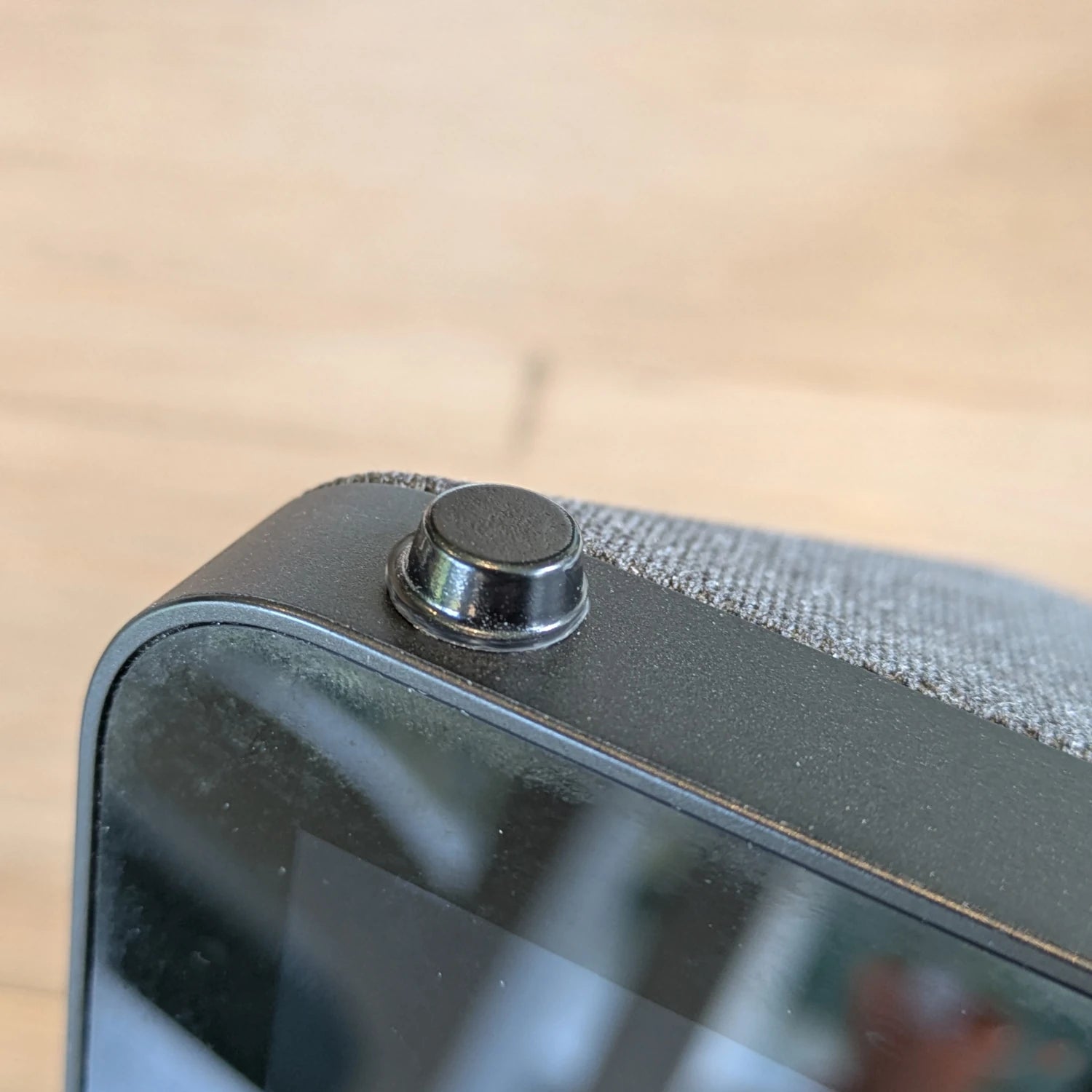 A black flat topped bumper foot applied to an electronic device.