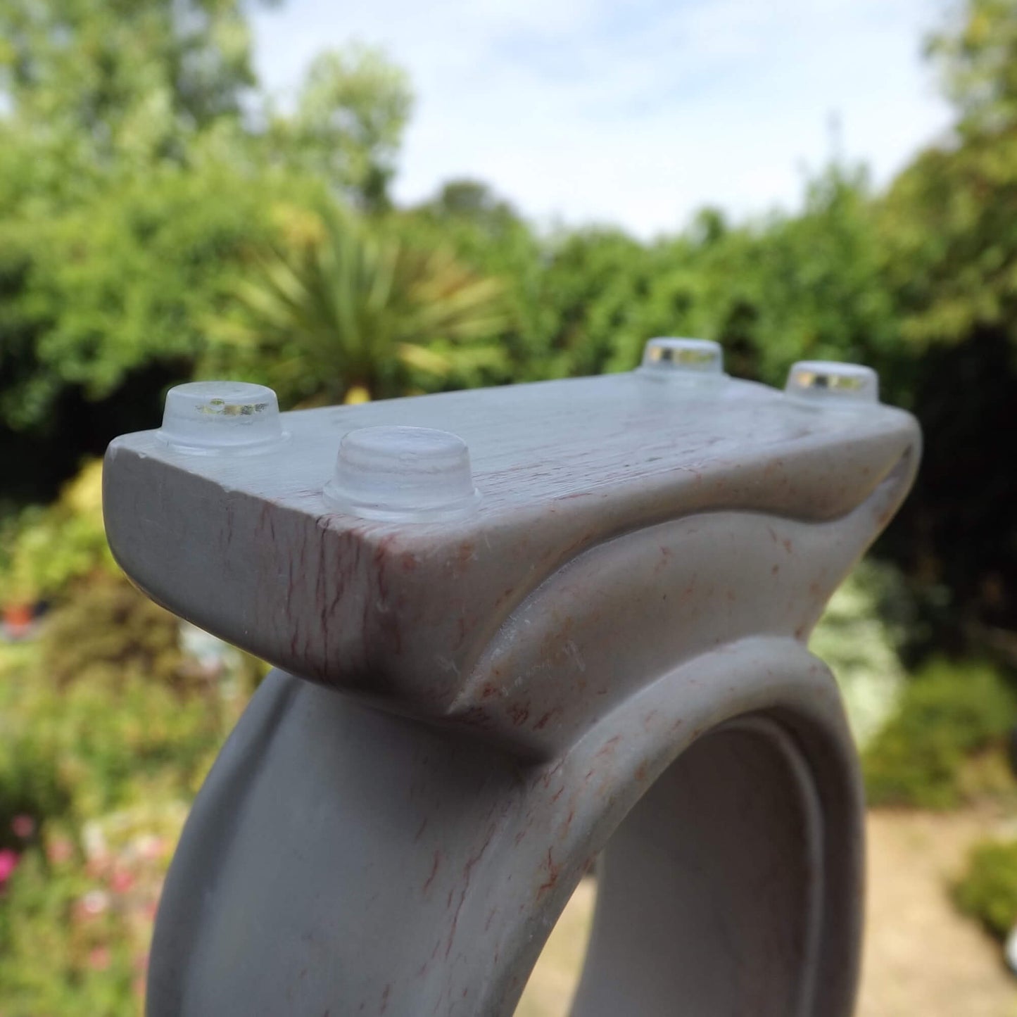 4 clear flat topped bumper feet used on the base of a ceramic ornament to protect it.
