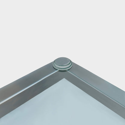 A glass bumper foot being used on a glass table-top.