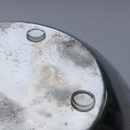 Bumper pads being used on the base of a galvanized metal bowl.