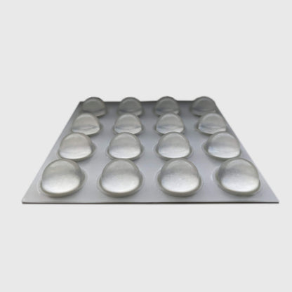 An adhesive backed sheet of 16 domed bumper feet.