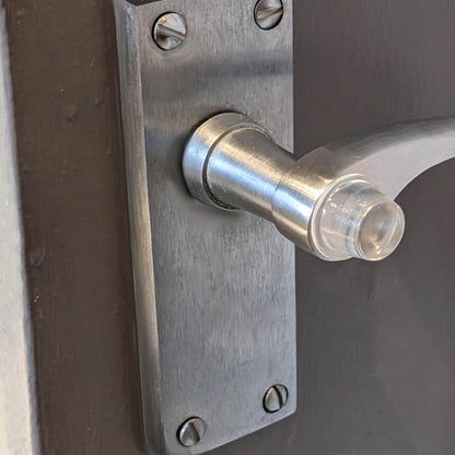 Bumper being used on a door handle to ensure no damage occurs when the handle hits the adjoining wall.