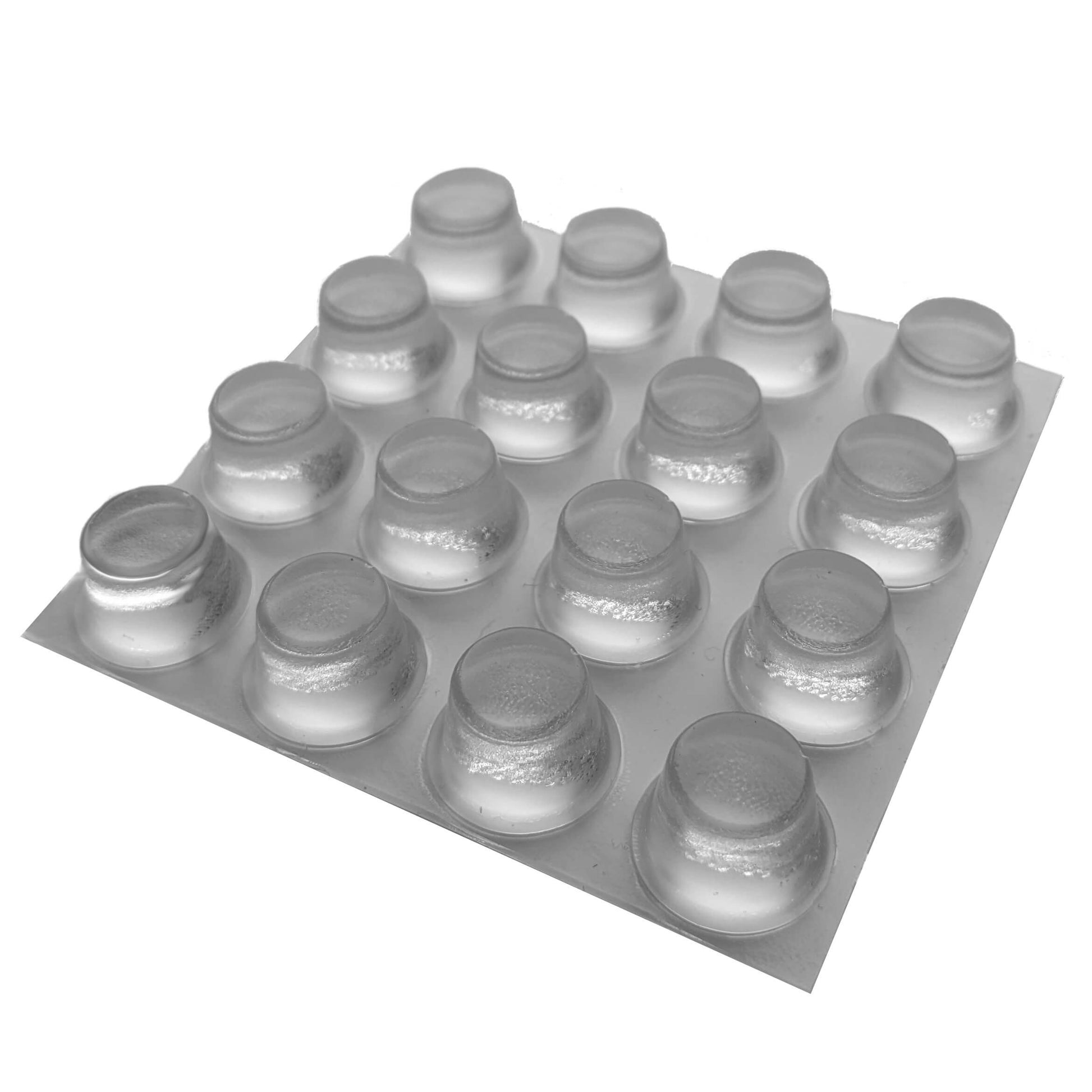 16 clear tall flat topped bumper feet on an adhesive backed sheet.