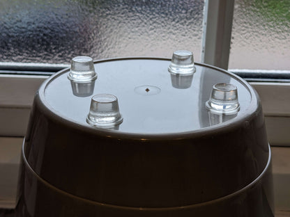 4 heavy duty tall bumper feet used on the base of a plant pot.