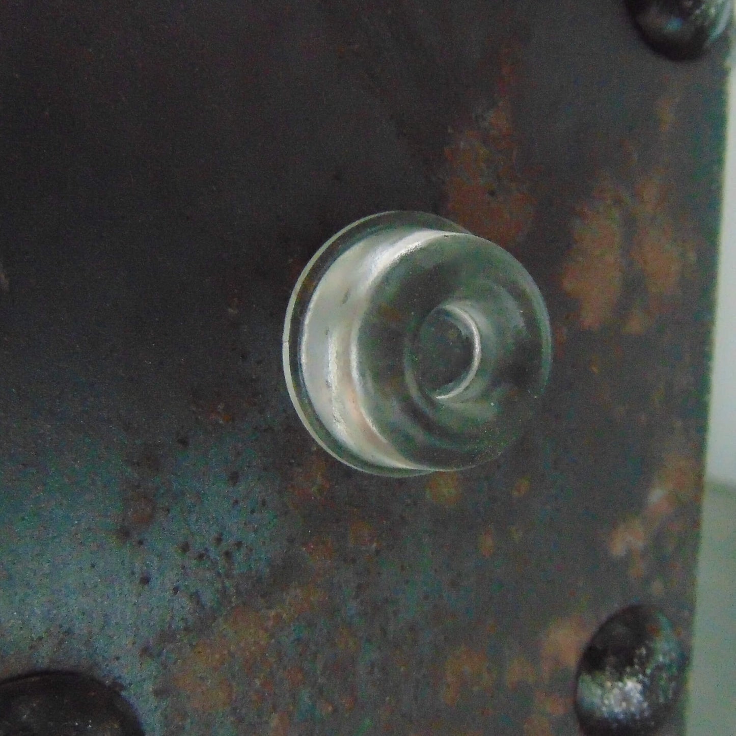Recessed bumper used on a metal case.