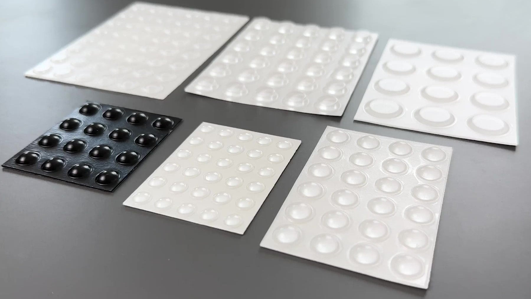 5 Sheets of adhesive backed bumper pads and dots in various sizes.